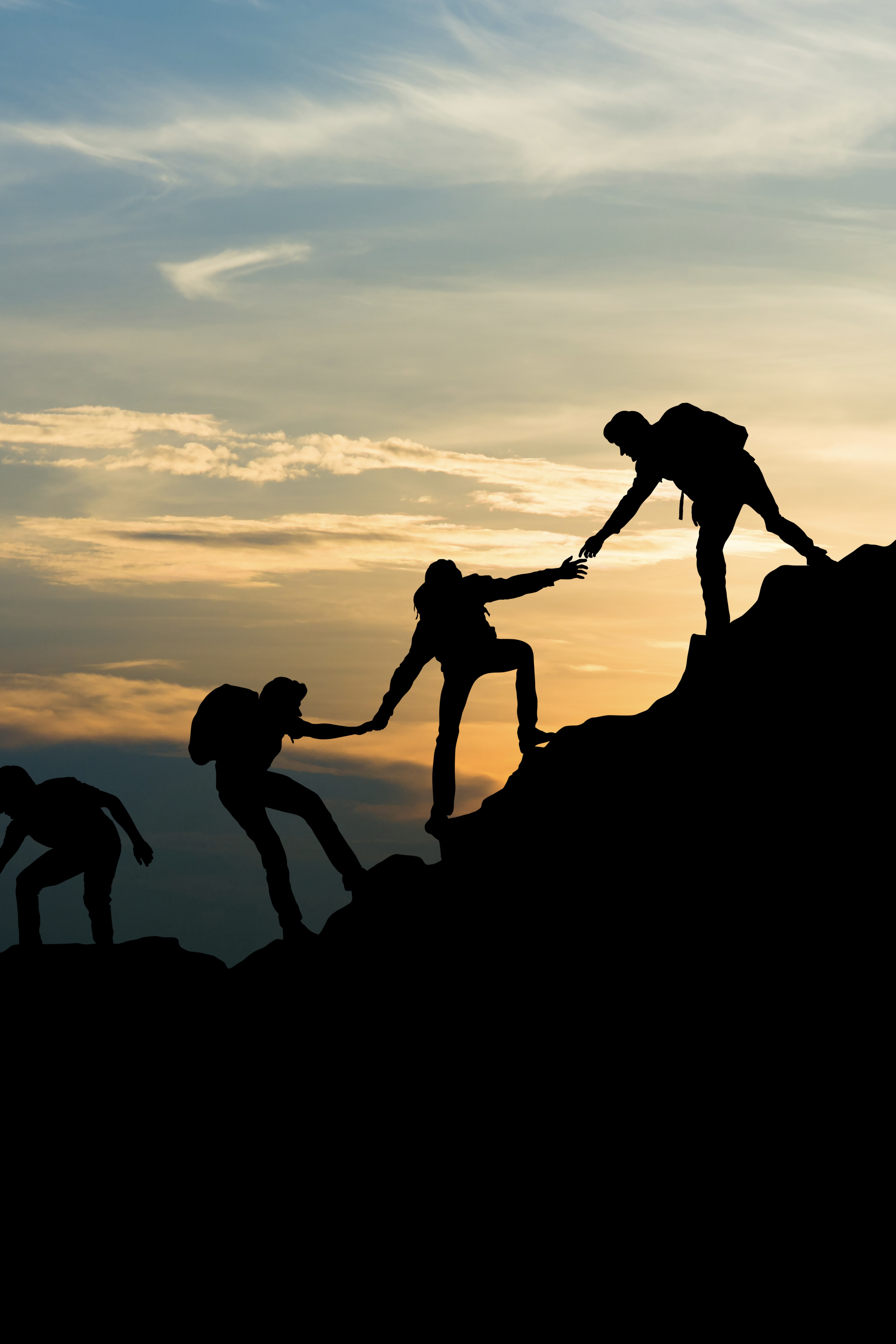 Team climbing a hill